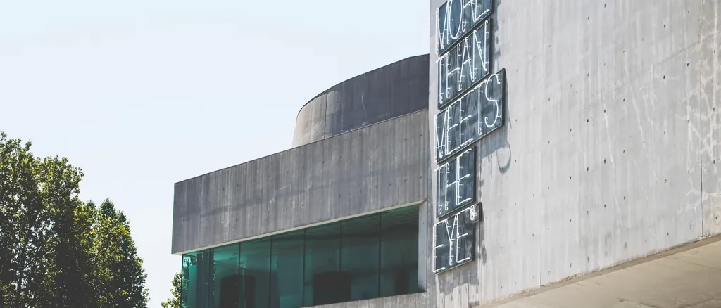 Contemporary concrete building with deep overhangs