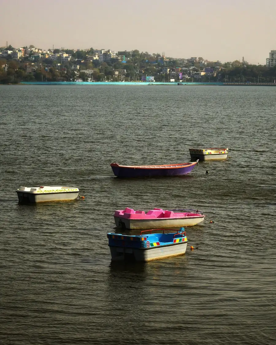 Boats on the Upper Lake in Bhopal, with the city on the hills beyond