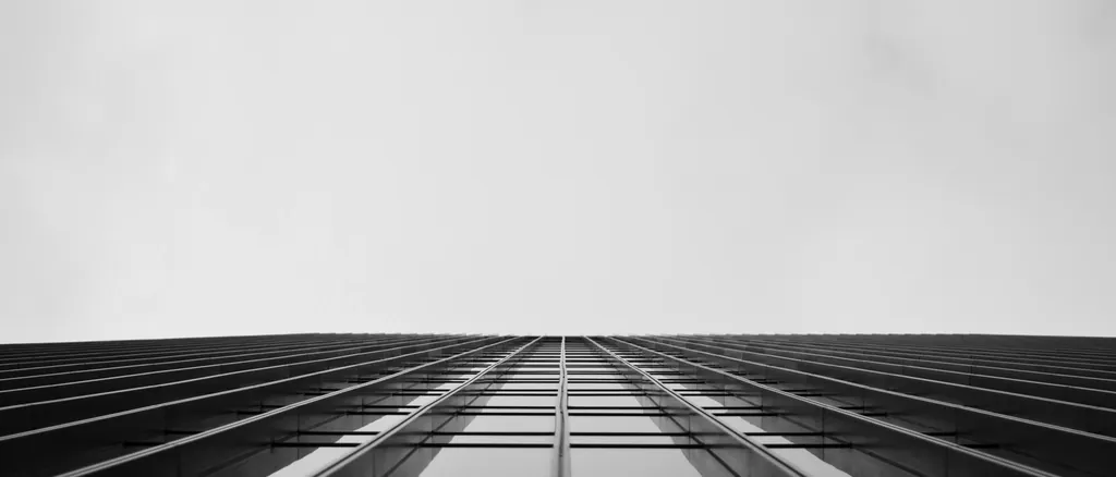 Looking up at a glazed commercial facade